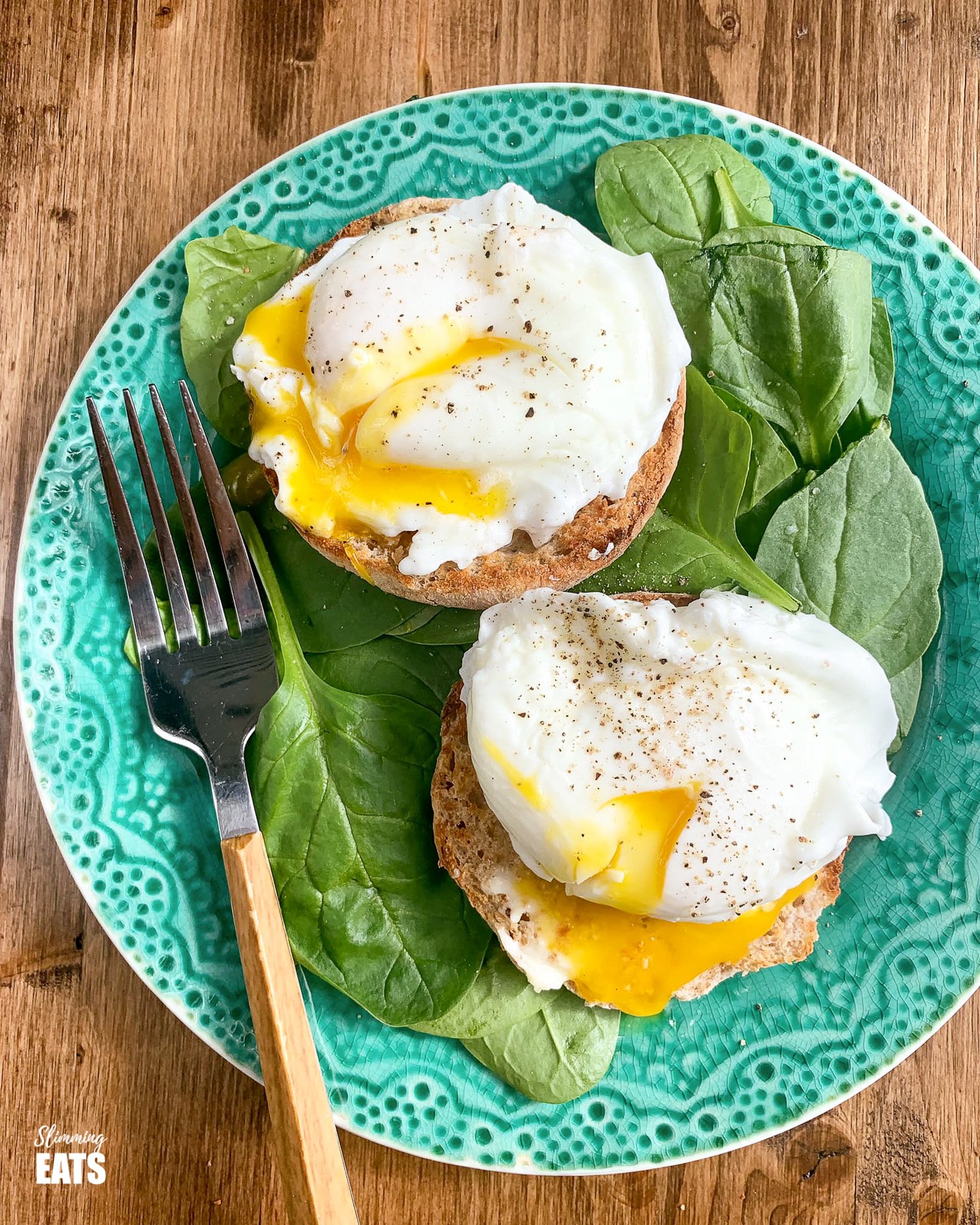 Easy Cheats Poached Eggs - A simple cheats fool proof method to get perfect poached eggs every time. Poached Eggs over toasted wholewheat muffins with baby spinach