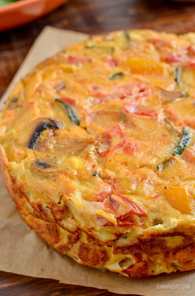 close up of Dairy Free Crustless Bacon and Vegetable Quiche on parchment paper