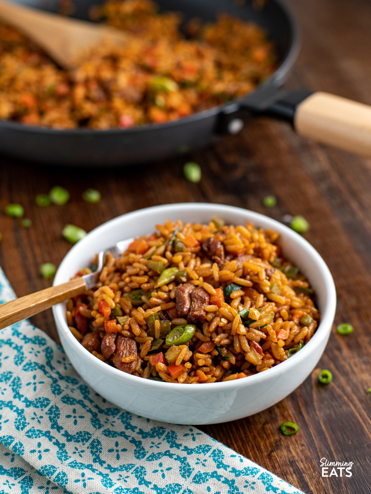 Teriyaki Chicken and Rice Bowl in white bowl with wooden handle fork