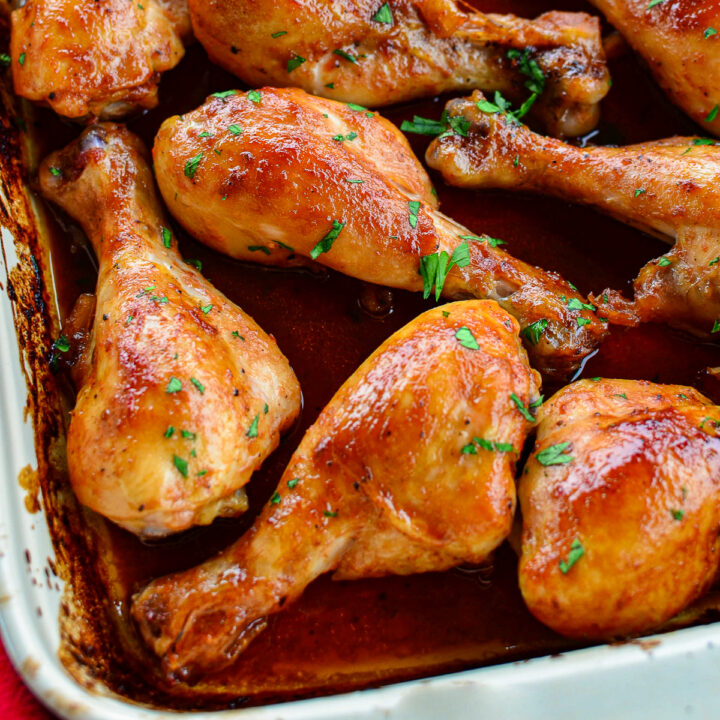 Cooked Maple Glazed Chicken drumsticks in a baking dish