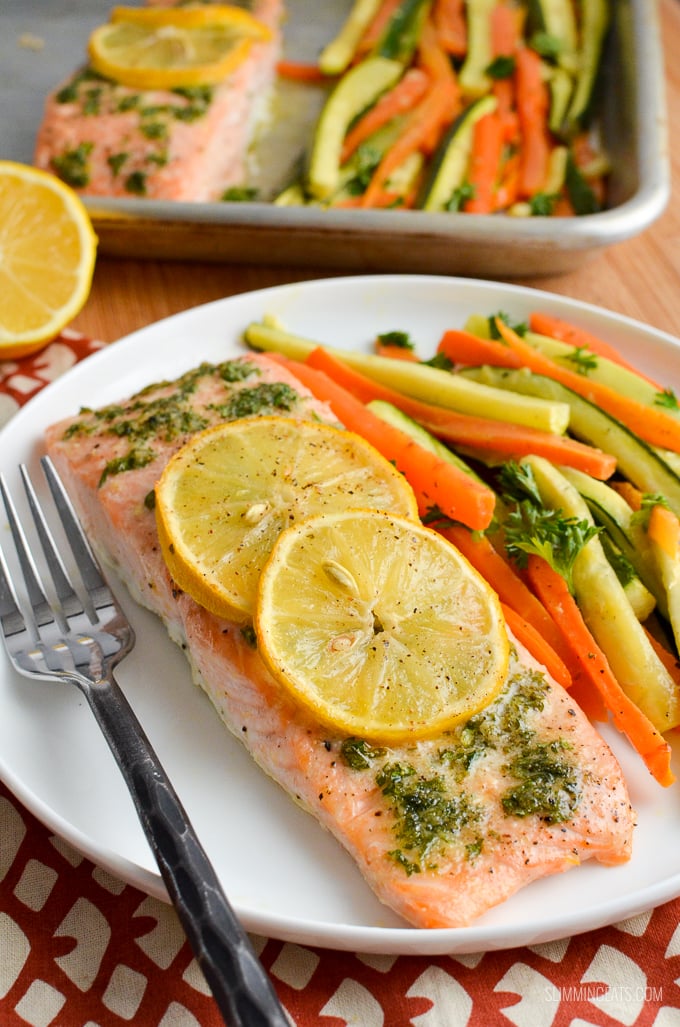 Simple Delicious Lemon and Herb Butter Salmon Traybake - succulent salmon fillets with the flavours of garlic, herbs and butter. Gluten Free, Slimming World and Weight Watchers friendly #slimmingworld #weightwatchers #traybake #salmon