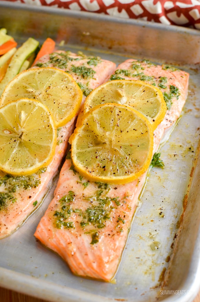 Simple Delicious Lemon and Herb Butter Salmon Traybake - succulent salmon fillets with the flavours of garlic, herbs and butter. Gluten Free, Slimming Eats and Weight Watchers friendly #slimmingeats #weightwatchers #traybake #salmon