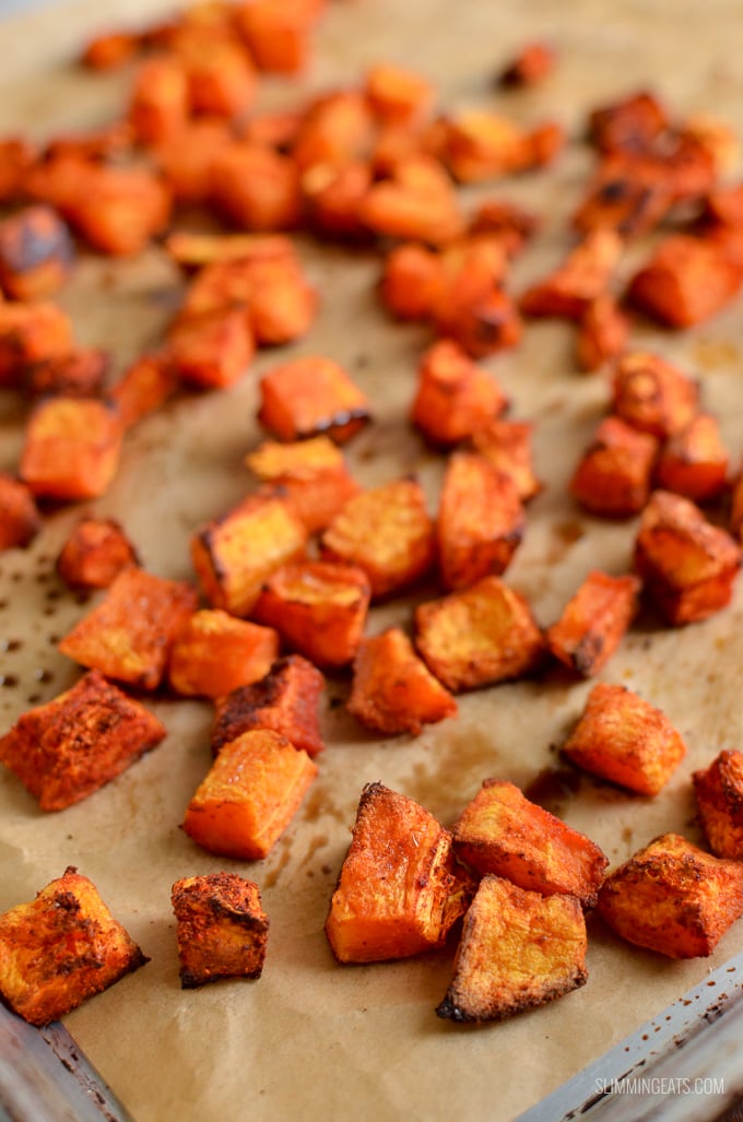 roasted butternut squash on a parchment paper lined tray