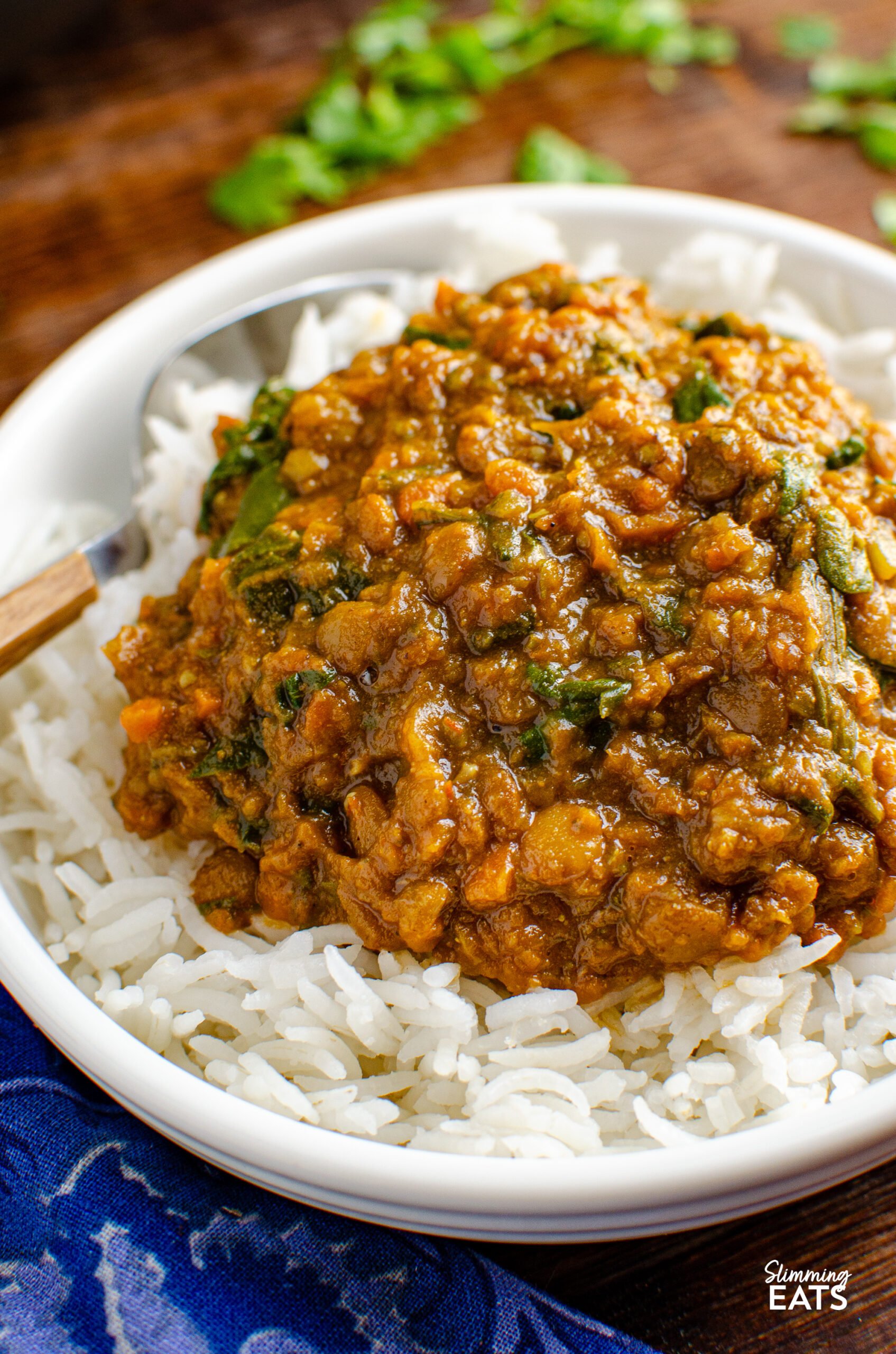 Delicious Spicy Lentils and Spinach - a perfect meal for Meatless Mondays! Even non-vegetarians will love this recipe. Lentils are not only affordable but also a fantastic source of protein and fiber. I always keep different varieties in my pantry; red lentils for soups and daal, and chunkier lentils like brown or green lentils as a substitute for ground meat in recipes.