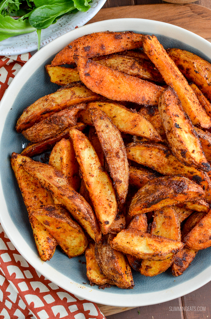 Add a spicy kick to your main course, with this delicious and healthier oven-baked Spicy Potato Wedges - yum!! Gluten Free, Dairy Free, Vegetarian, Slimming Eats and Weight Watchers friendly | www.slimmingeats.com
