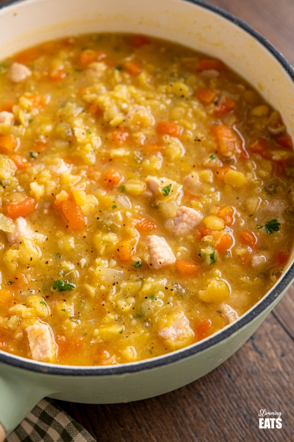 close up of split pea and bacon soup in cast iron saucepan