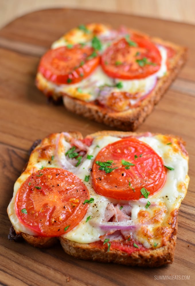 yummy pizza toasts on a wooden board