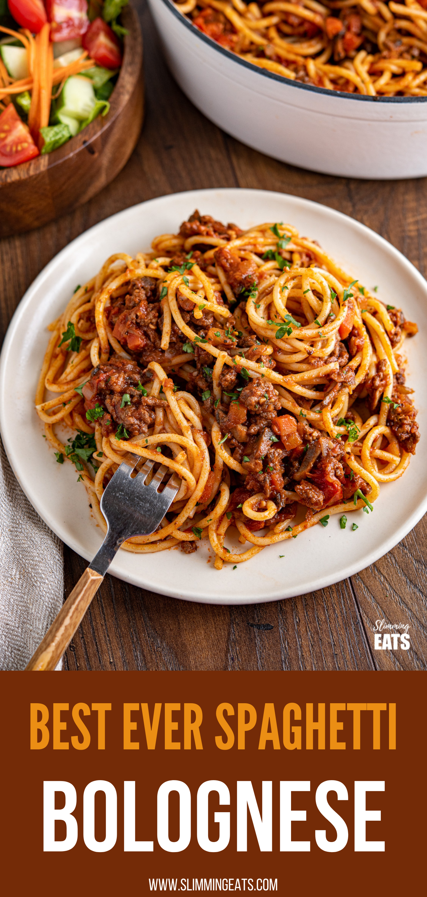 spaghetti bolognese on plate with fork, bowl of salad and pan of bolognese in background pin image.