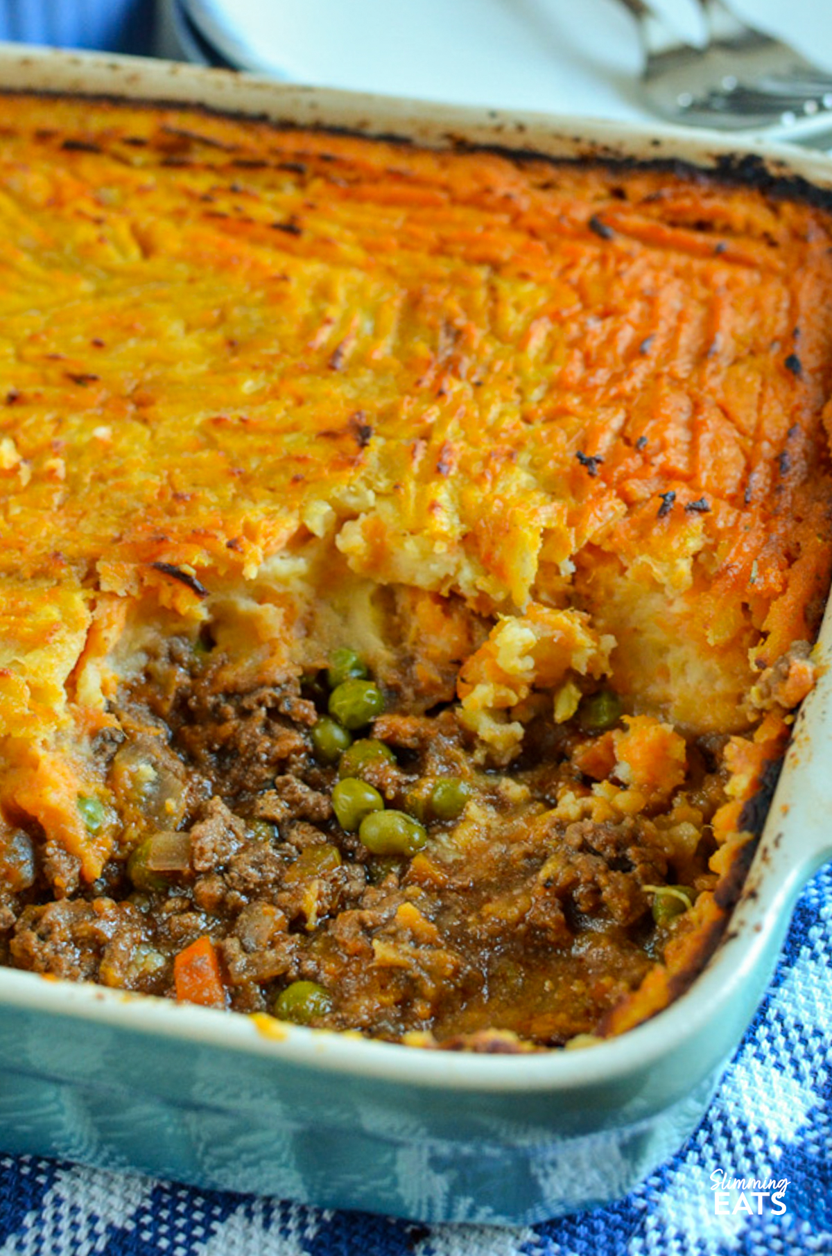cottage pie in a oven dish with a spoonful removed