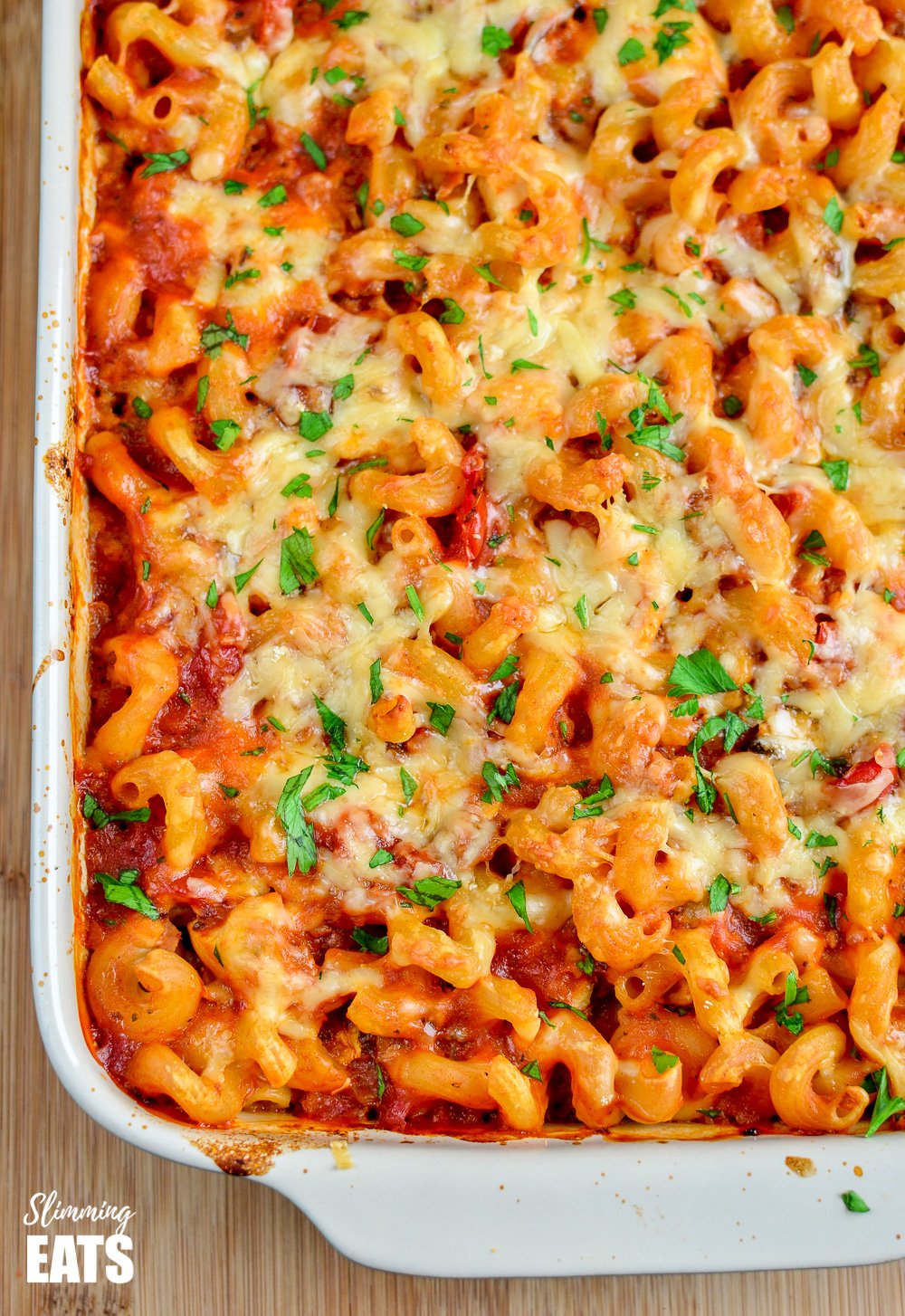 Chicken Bacon and Tomato Pasta Bake - one of the best family-friendly pasta bakes EVER!! #slimming #weightwatchers #chicken #bacon #pasta close up of chicken bacon and tomato paste bake in oven proof dish