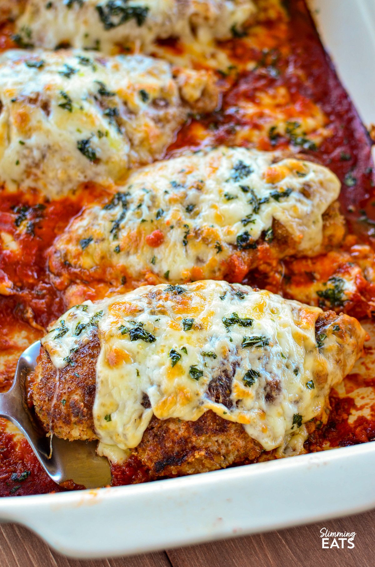 close up of Chicken Parmesan in le creuset oven baking dish