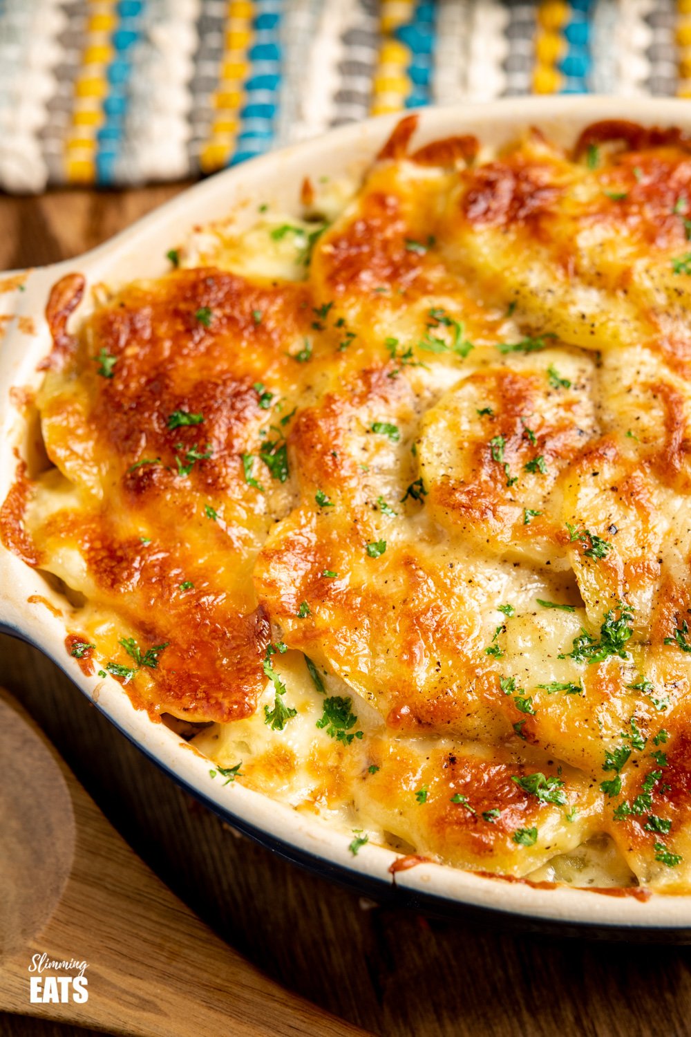 Delicious Cheesy Leek and Potato Bake - easy to make and perfect to enjoy as a side dish or even a main course. Gluten Free, Vegetarian, Slimming World and Weight Watchers friendly close up of leek and potato bake