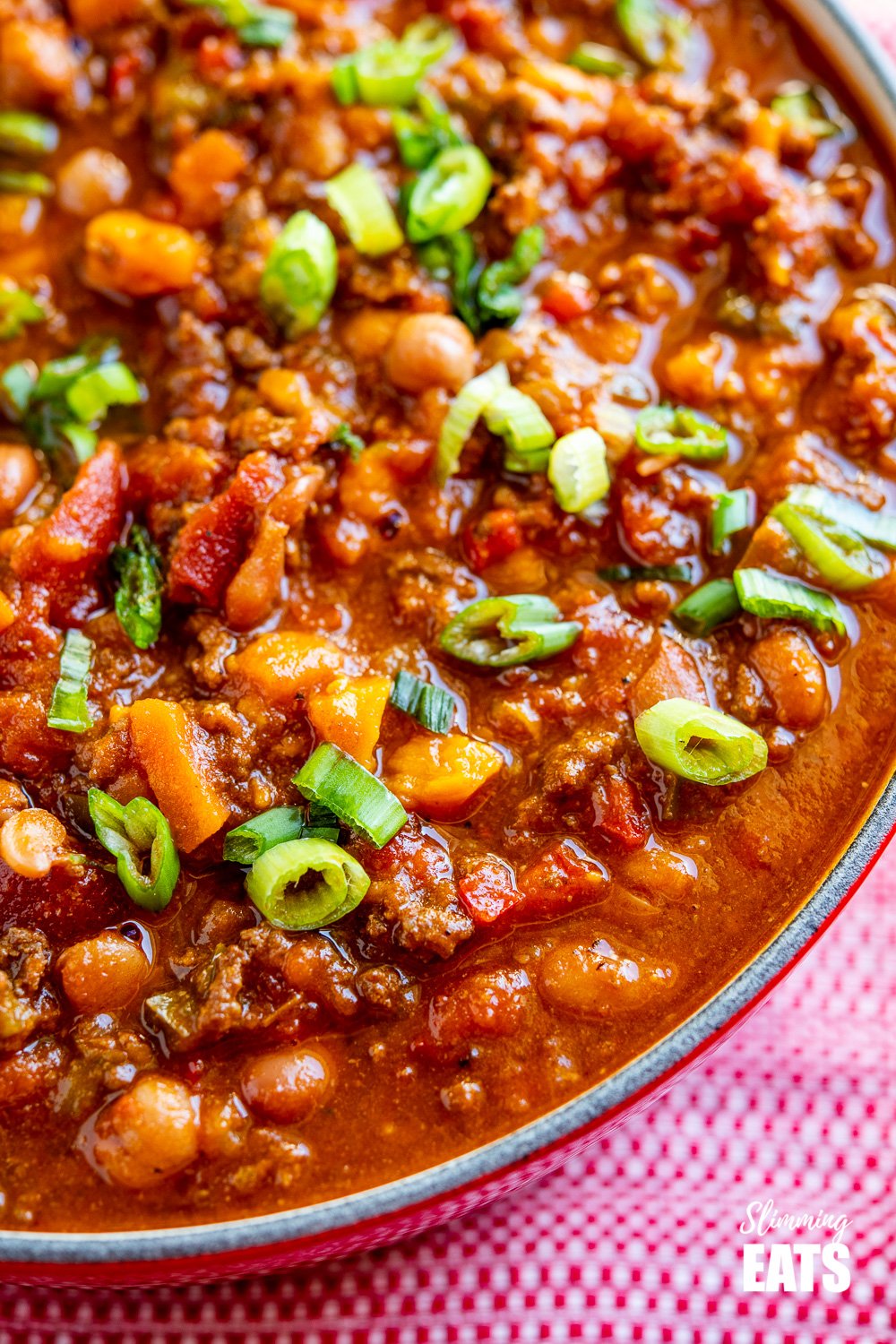 close up of beef and six bean chilli in le creuset dutch oven