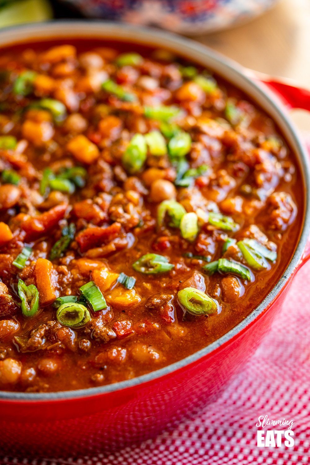 close up of beef and six bean chilli in crimson red le creuset dutch oven