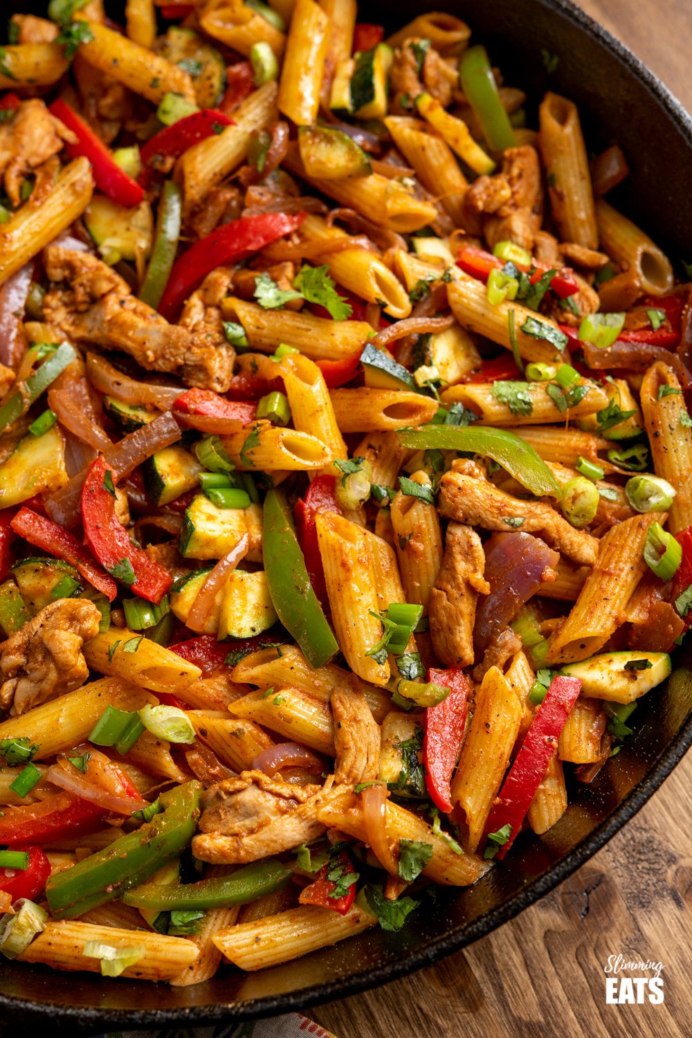 close up of Fajita Chicken Pasta in a lodge cast iron skillet