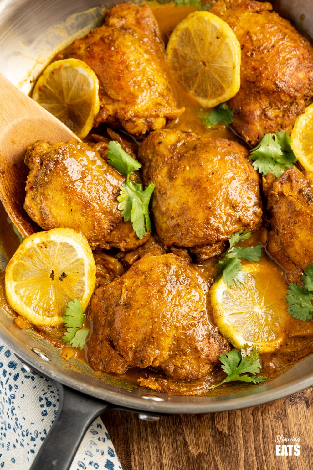 Lemon Chilli Chicken - One of my all-time favourite recipes, super simple to make with a delicious citrusy spicy sauce. Gluten Free, dairy free, paleo, Whole30, Slimming Eats and Weight Watchers friendly close up of lemon chilli chicken in skillet