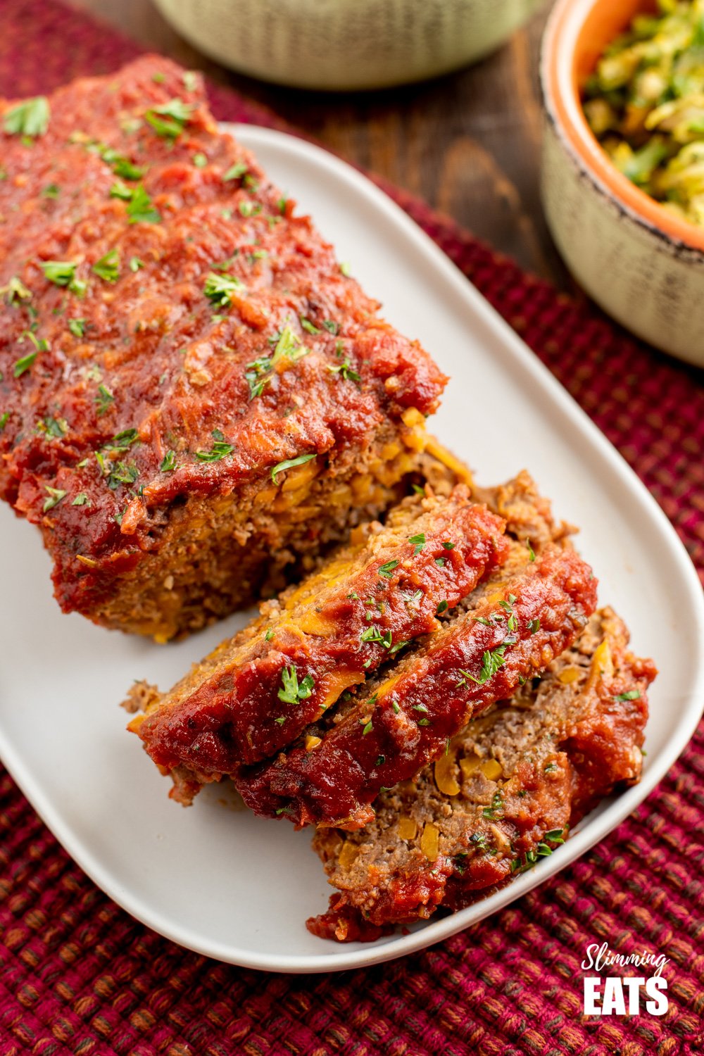 sliced beef and sweet potato meatloaf on a white plate