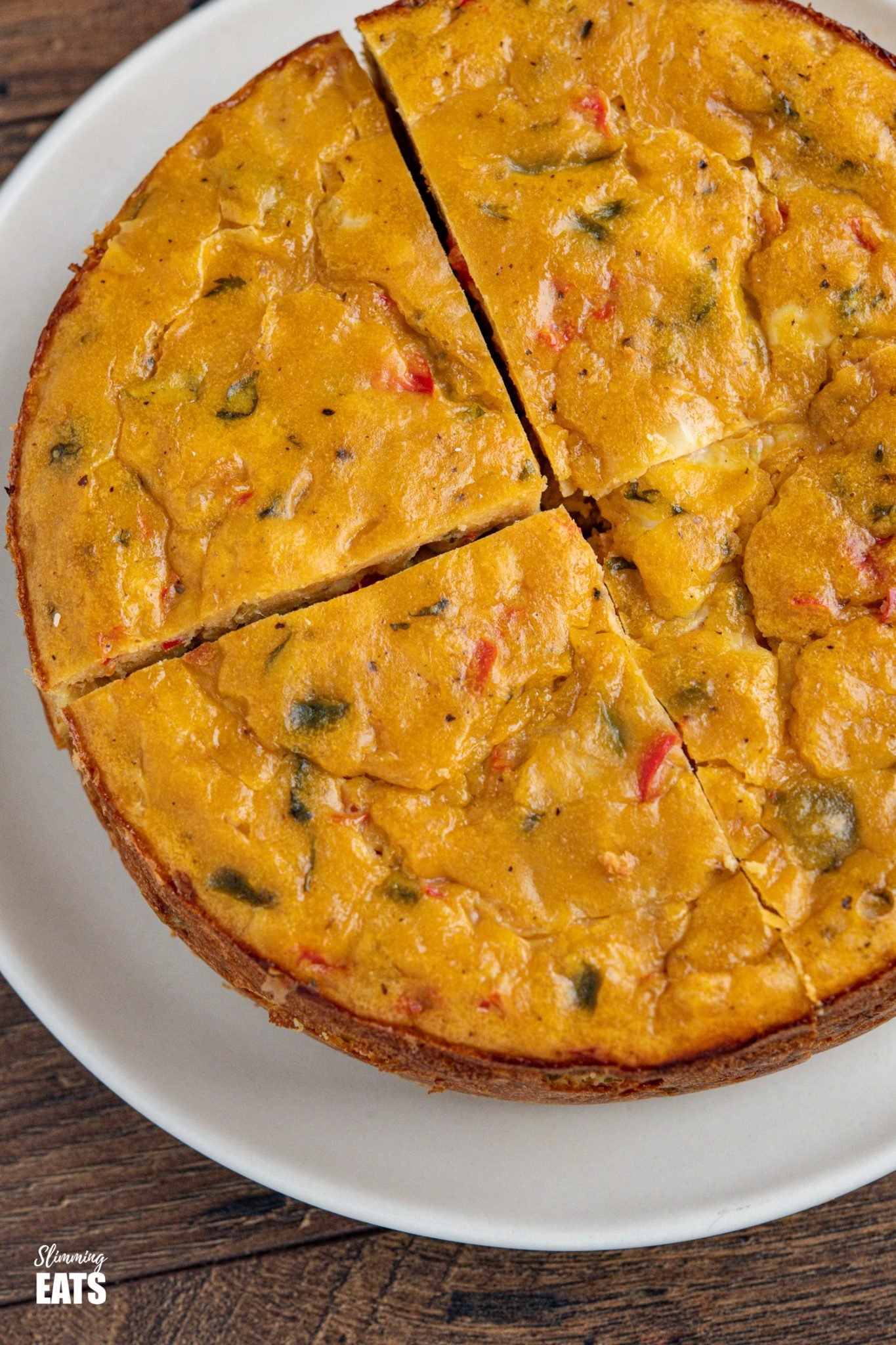 Lentil Cheddar Bake - a cheesy lentil bake with peppers that is great as it is with a salad or as a side to soup or chilli. Gluten Free, Vegetarian, Slimming Eats and Weight Watchers friendly close up of sliced lentil cheddar bake on plate