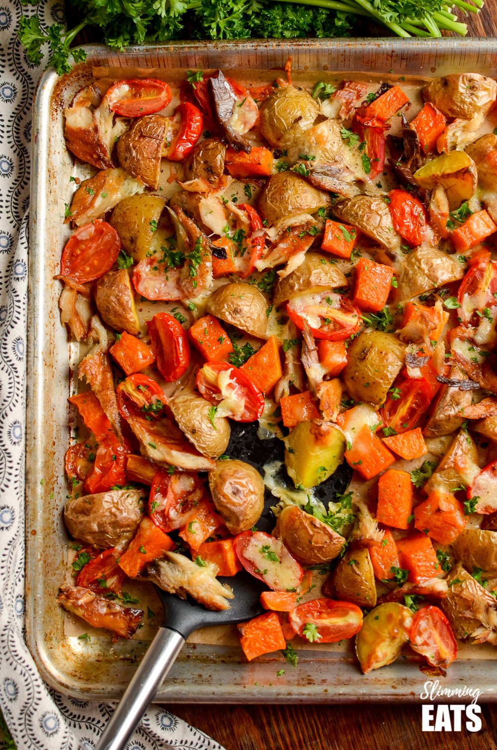 over the top view of smoked mackerel bake on a baking tray with spatula