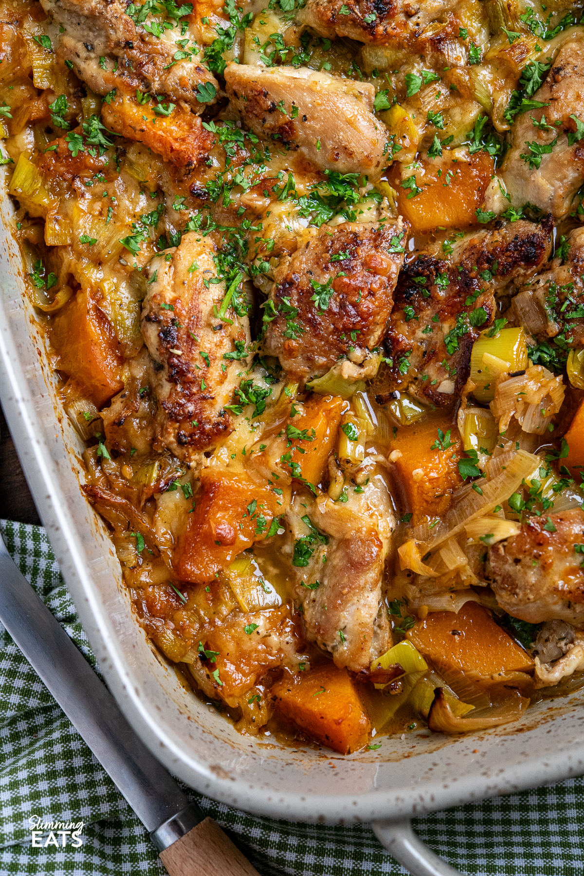 close up Chicken, Leek and Butternut Squash Bake double handled grey oven proof dish