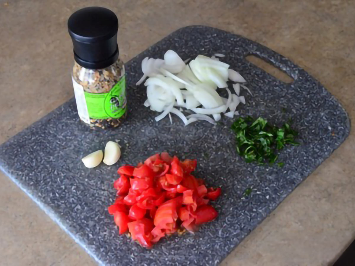 ingredients for Mayan Heirloom Squash with Tomatoes and Basil on a board
