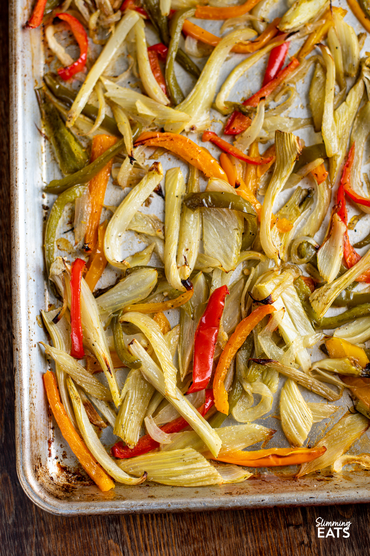 Roasted Fennel and Mixed Peppers on a baking tray lined with parchment