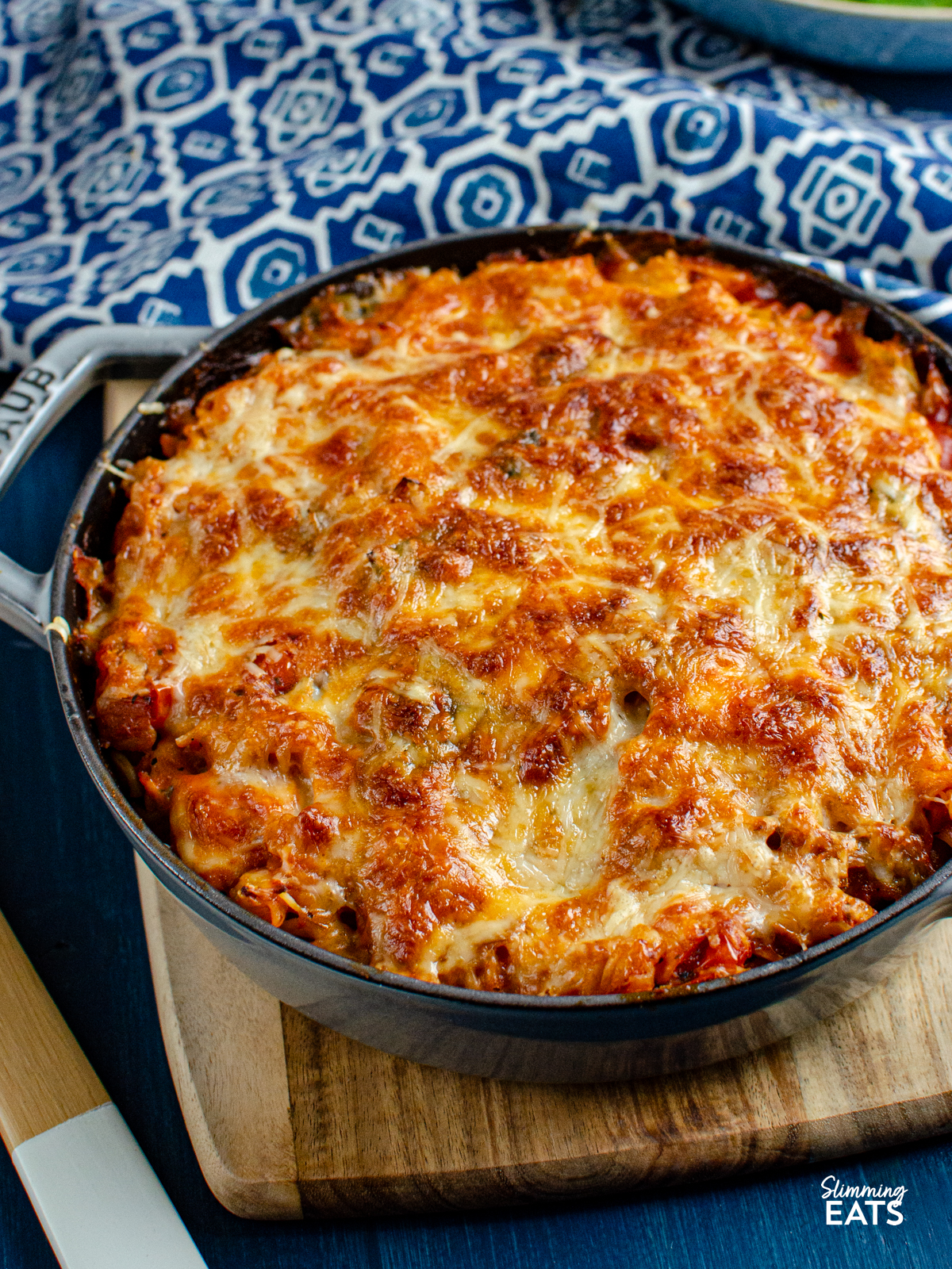Salmon and Leek Pasta Bake - Salmon and Leek Pasta Bake - a delicious recipe using fresh salmon, sauteed leeks and a homemade tomato pasta sauce, all finished off with melted cheesy goodness - yum!! Slimming Eats and Weight Watchers friendly Salmon and Leek Pasta Bake is grey cast iron staub skillet