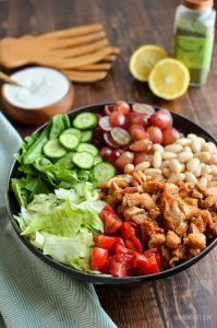 tuscan chicken salad, chopped in black bowl