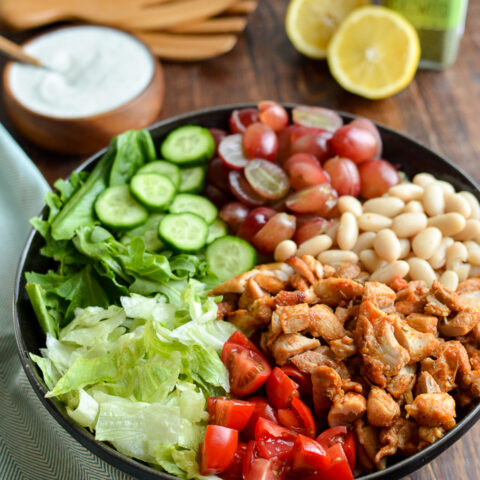 tuscan chicken salad, chopped in black bowl
