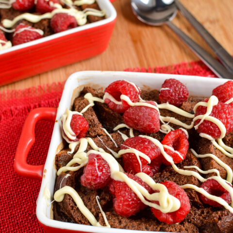 Chocolate Bread Pudding with Raspberries and White Chocolate Drizzle