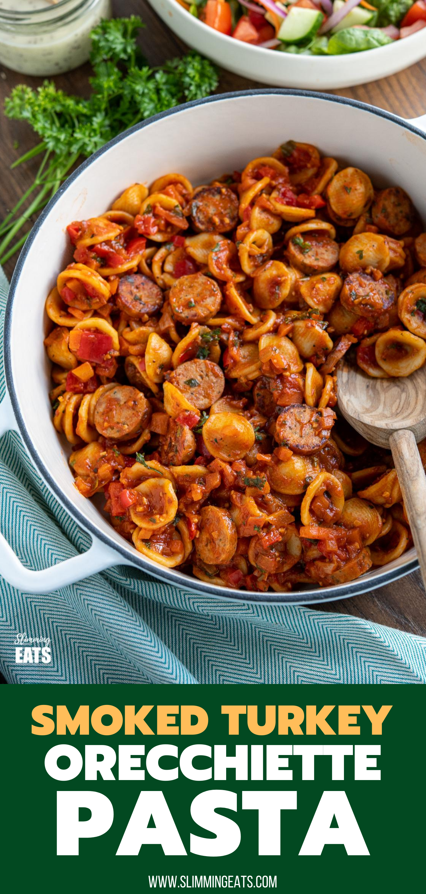 Orecchiette with Smoked Turkey Sausage - delicious bites of smoked sausage in rich tomato sauce with vegetables and orecchiette pasta. Slimming Eats and Weight Watchers friendly Orecchiette with Smoked Turkey Sausage in a skillet with olive wood spoon, salad in background