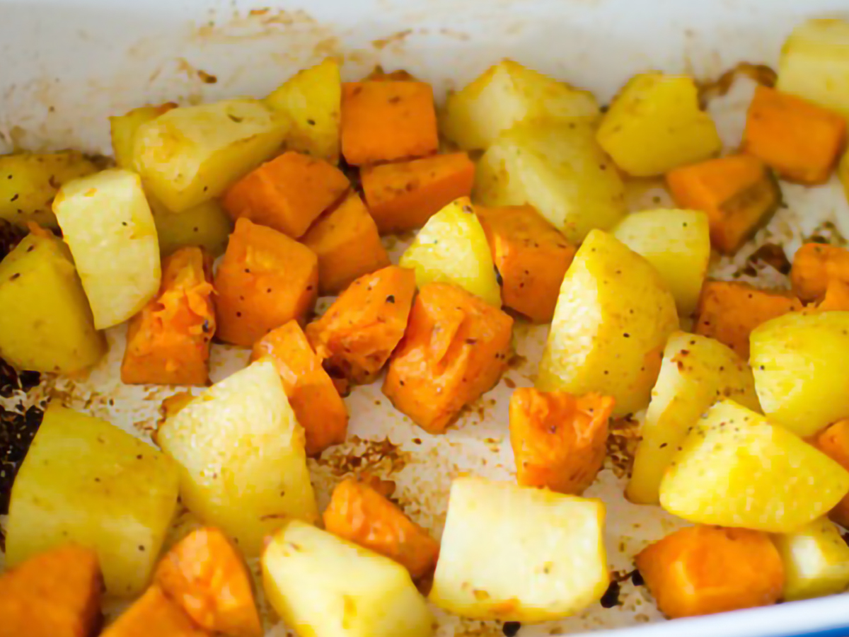 potatoes and sweet potatoes seasoned baked in a baking dish