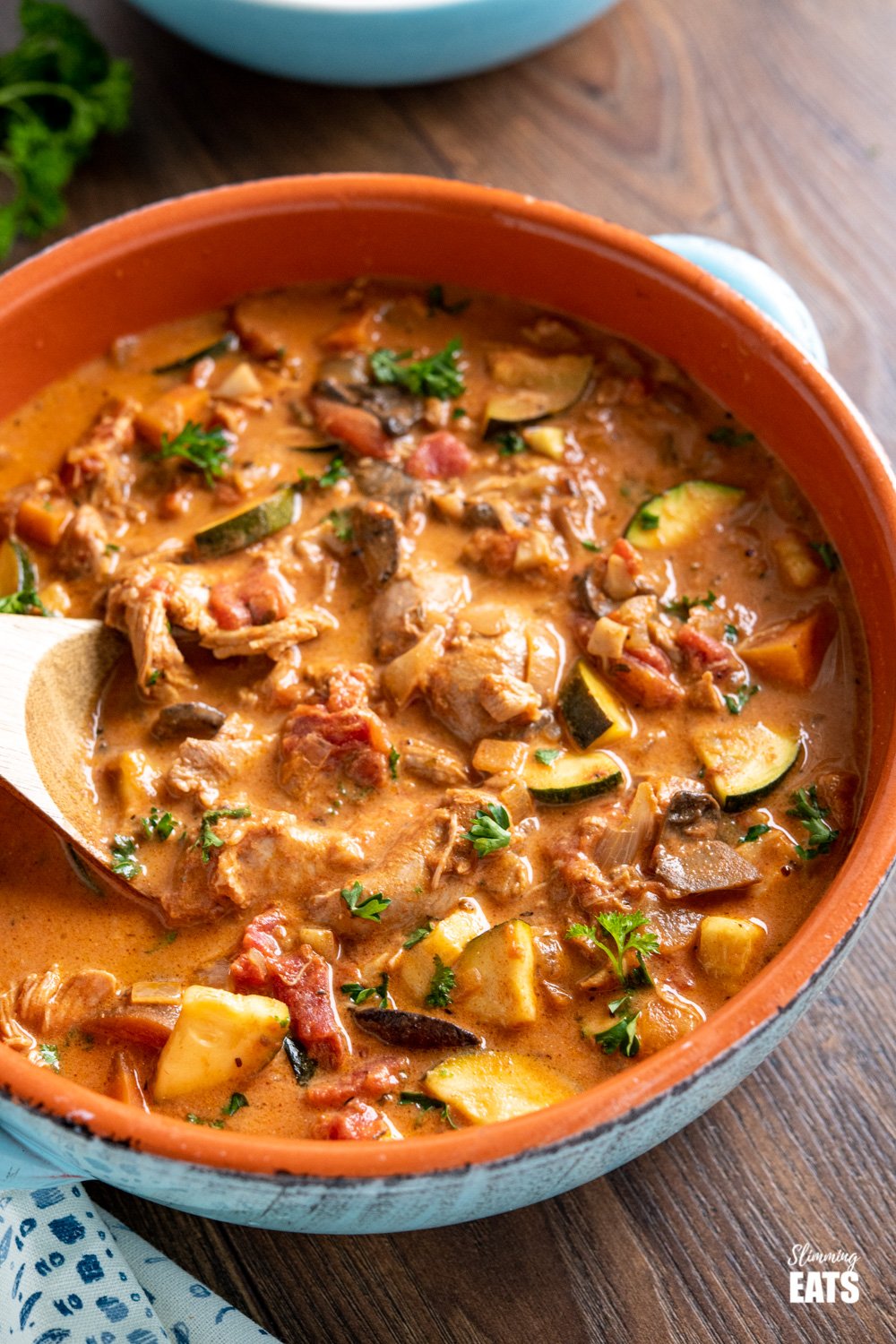 slow cooker creamy tomato and turkey casserole in ceramic blue dish