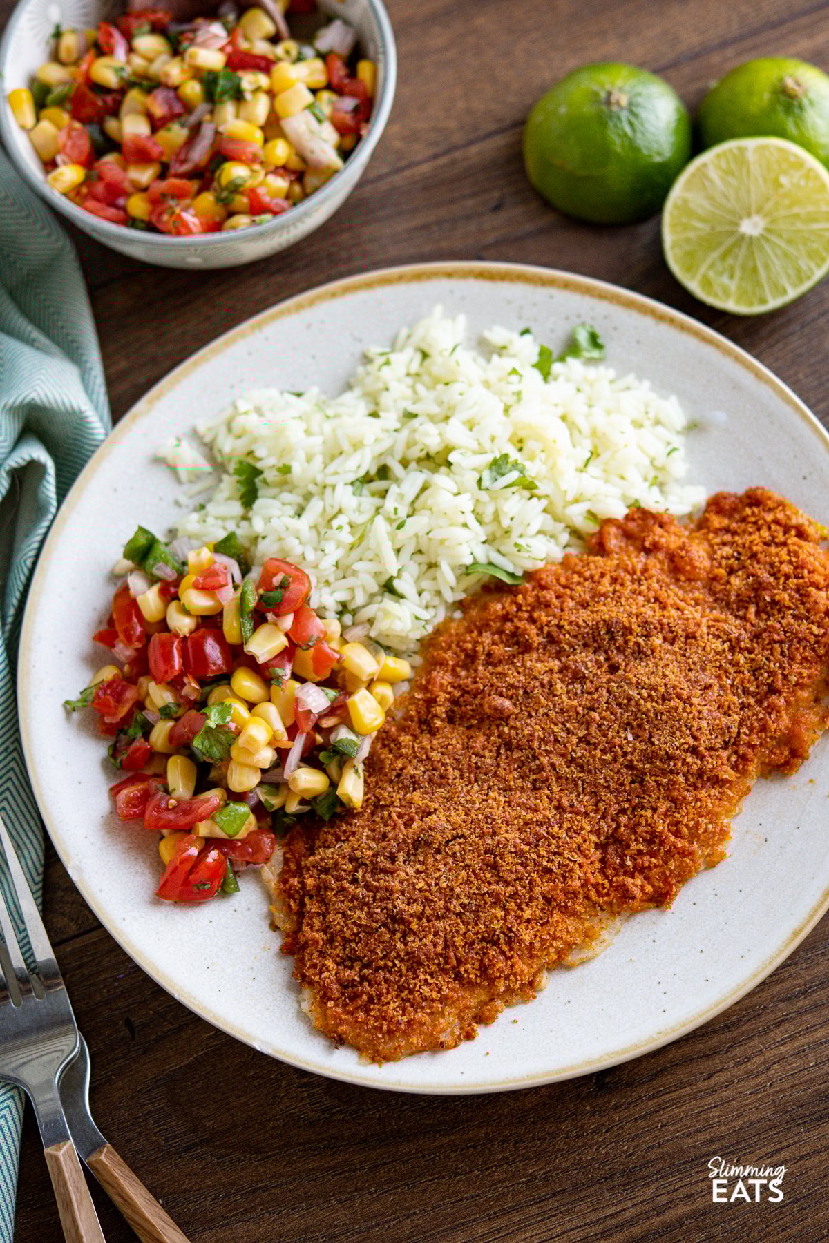 Cheesy Taco Breaded Basa Fillet - delicious oven baked basa with a golden cheesy taco breadcrumb topping, making this a great recipe for the whole family to enjoy. Slimming Eats and Weight Watchers friendly Cheesy Taco Breaded Basa Fillet on plate with rice and corn salsa