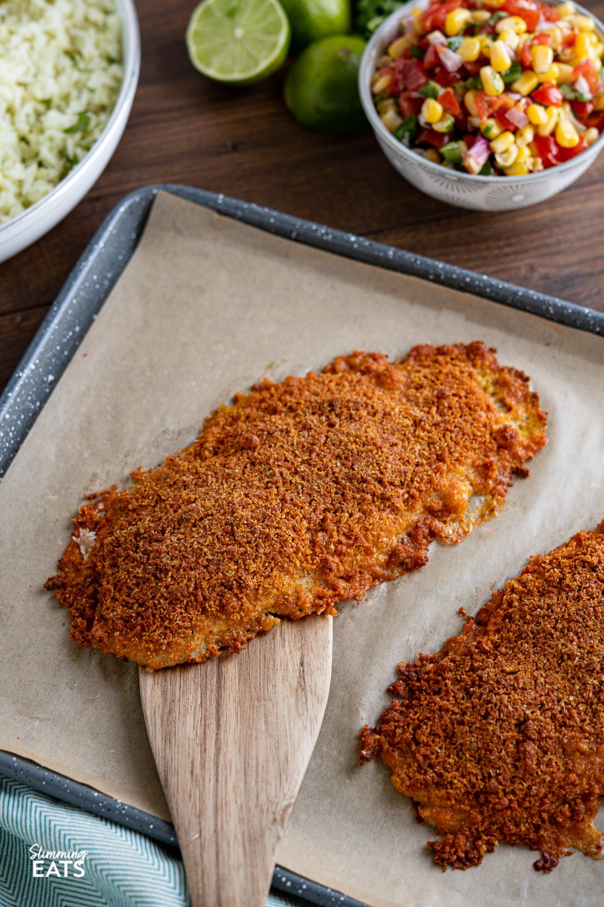 Cheesy Taco Breaded Basa Fillet - delicious oven baked basa with a golden cheesy taco breadcrumb topping, making this a great recipe for the whole family to enjoy. Slimming Eats and Weight Watchers friendly Cheesy Taco Breaded Basa Fillet on parchment lined baking tray