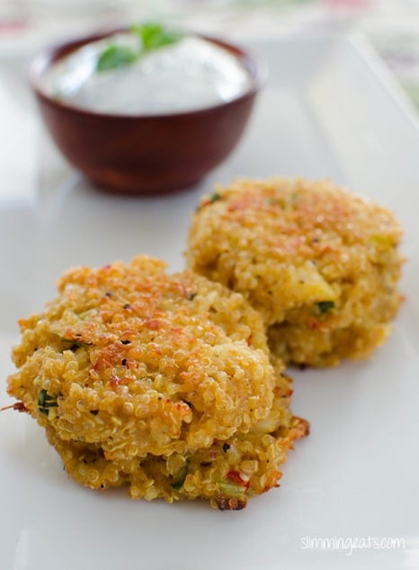 Crab and Quinoa Cakes - delicious patties made with fresh crab, cooked quinoa, spices and served with a simple yoghurt dip. Gluten Free, Slimming Eats and Weight Watchers friendly Crab and Quinoa Cakes stacked on white plate
