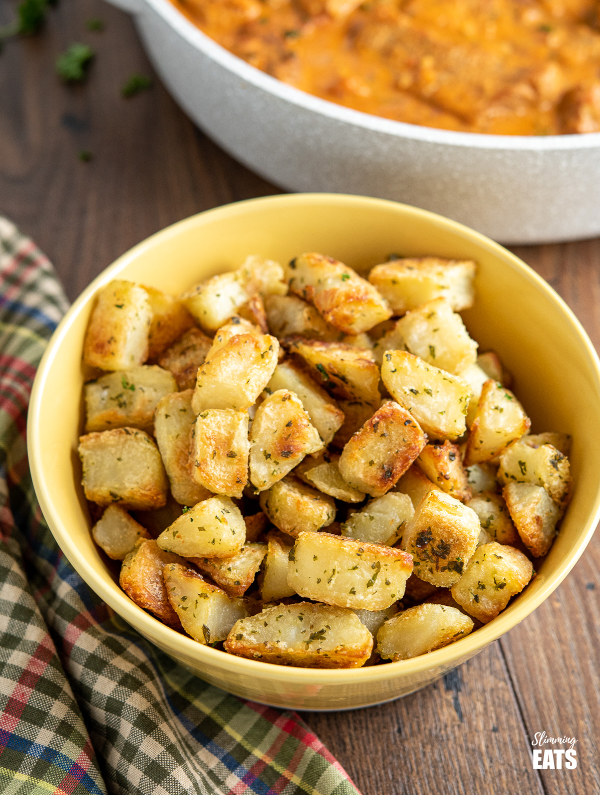 Garlic and Herb Roasted Potatoes in yellow bowl