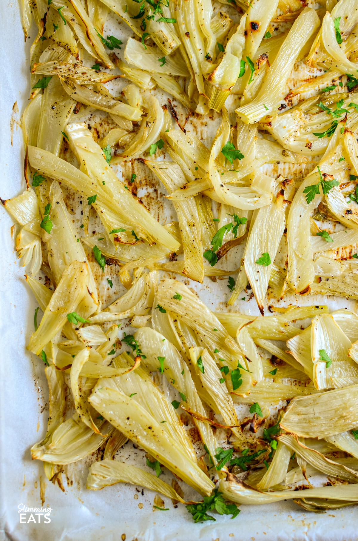 lemon garlic roasted fennel on a parchment lined tray