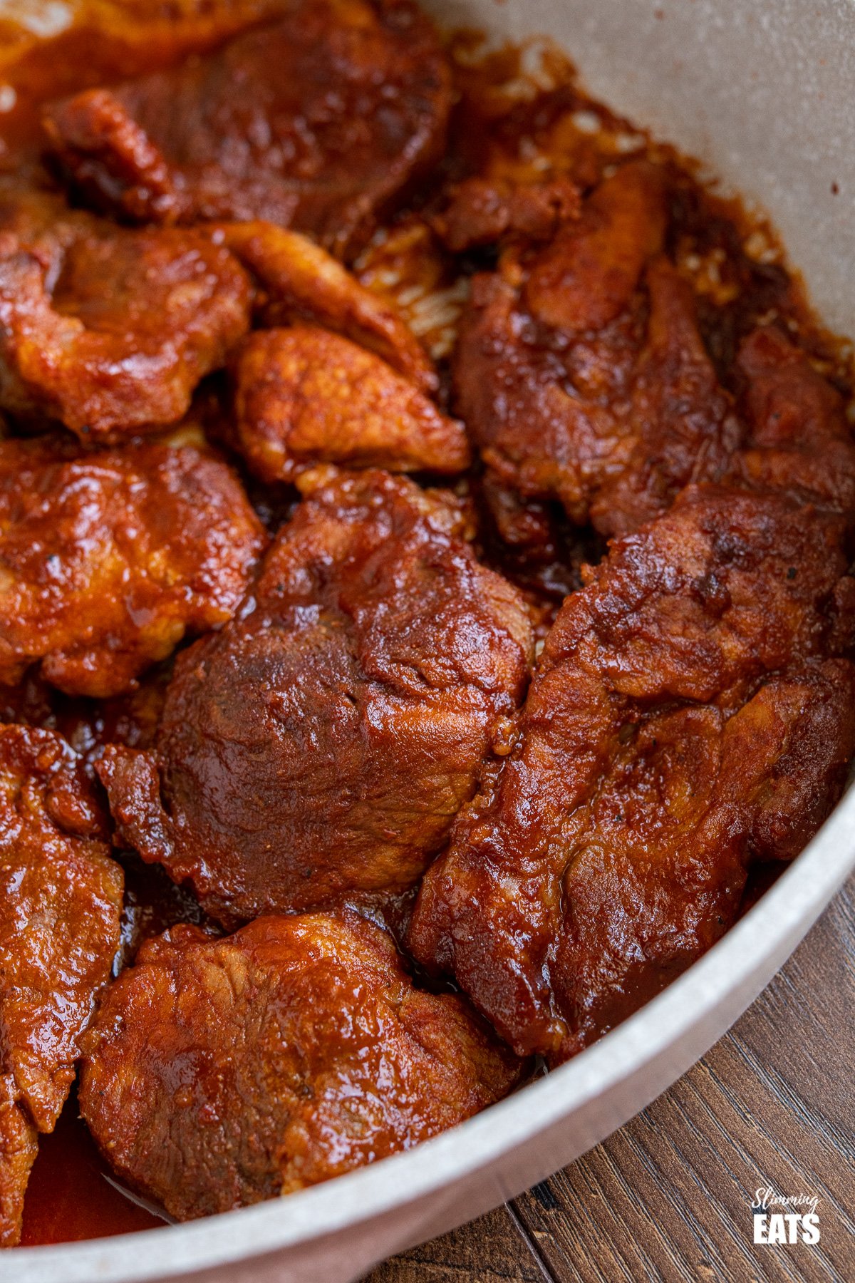 close up of stove top bbq pork in frying pan