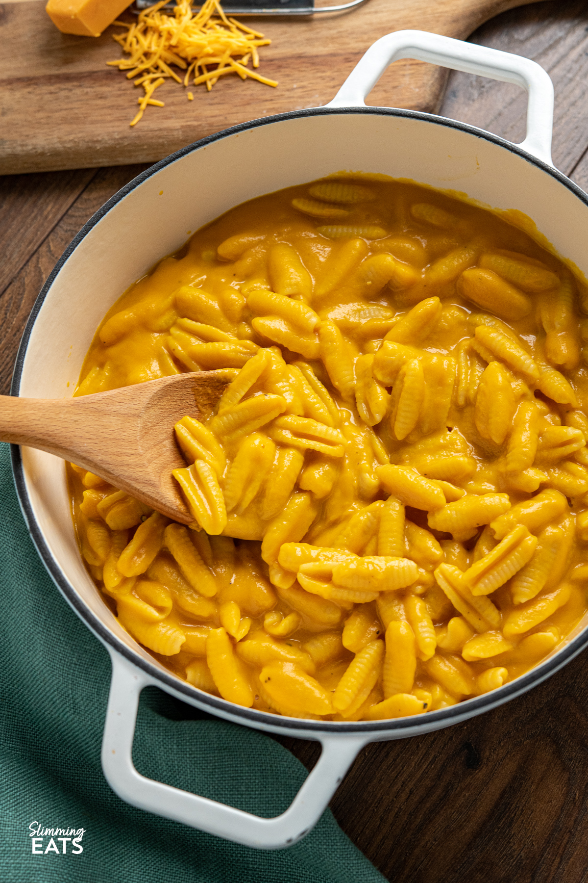 Creamy Butternut Squash Mac and Cheese in a white cast iron pan with two handles
