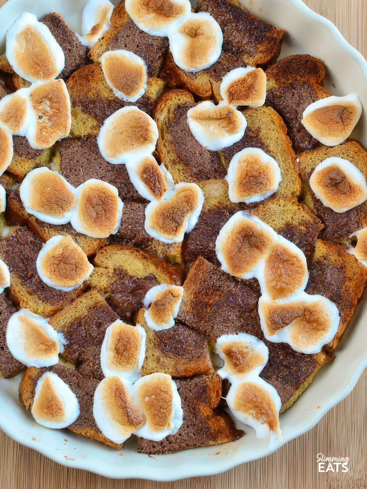 smores bread pudding in a ceramic pie dish