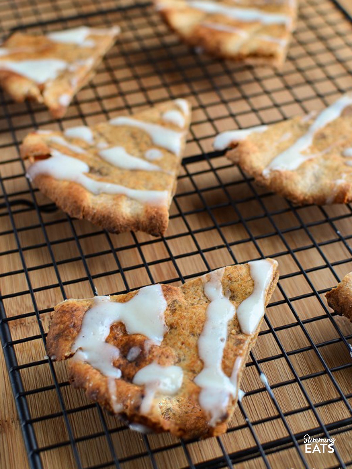 Golden crispy tortilla wraps filled with a delicious cinnamon sugar filling drizzled with a cream cheese icing. If you love cinnamon rolls - try these!! Cinnamon Roll Slice on rack