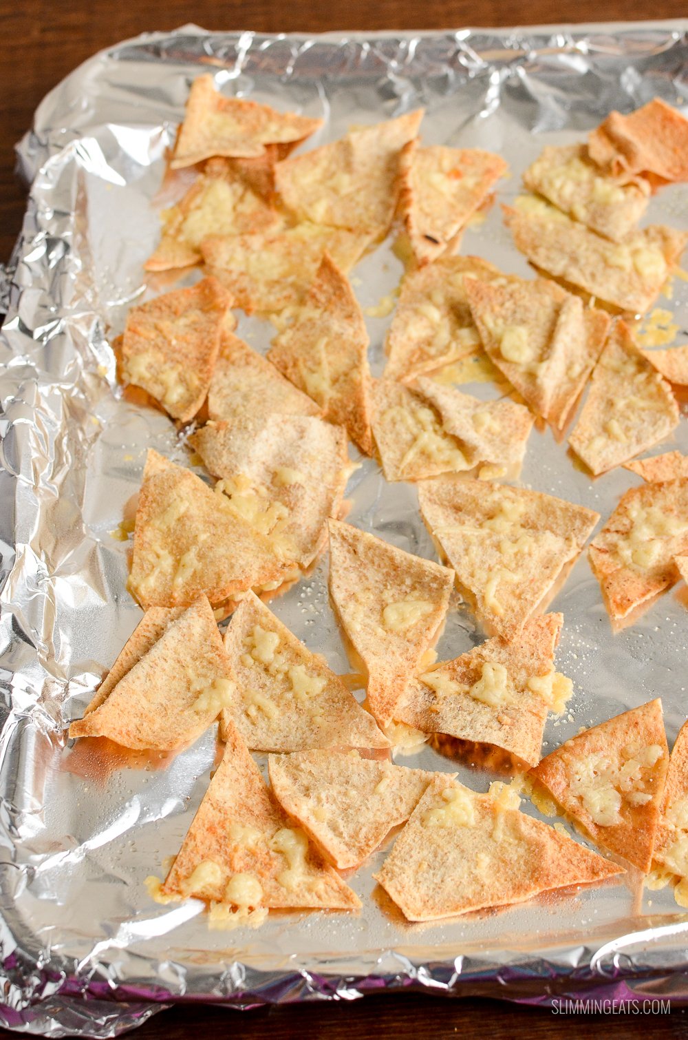 cheddar pita chips on a baking tray