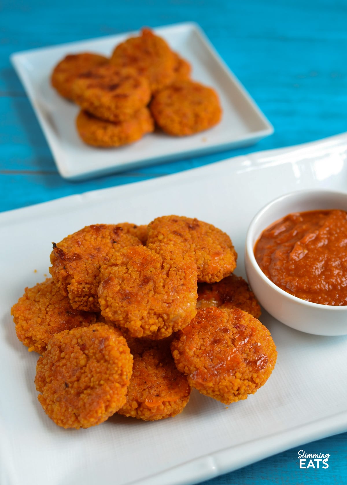 Cheesy tomato couscous bites with delicious tomato dip - great for lunch with some additional picky plate items or as an appetizer. Cheesy Couscous Bites with Tomato Dip on plate