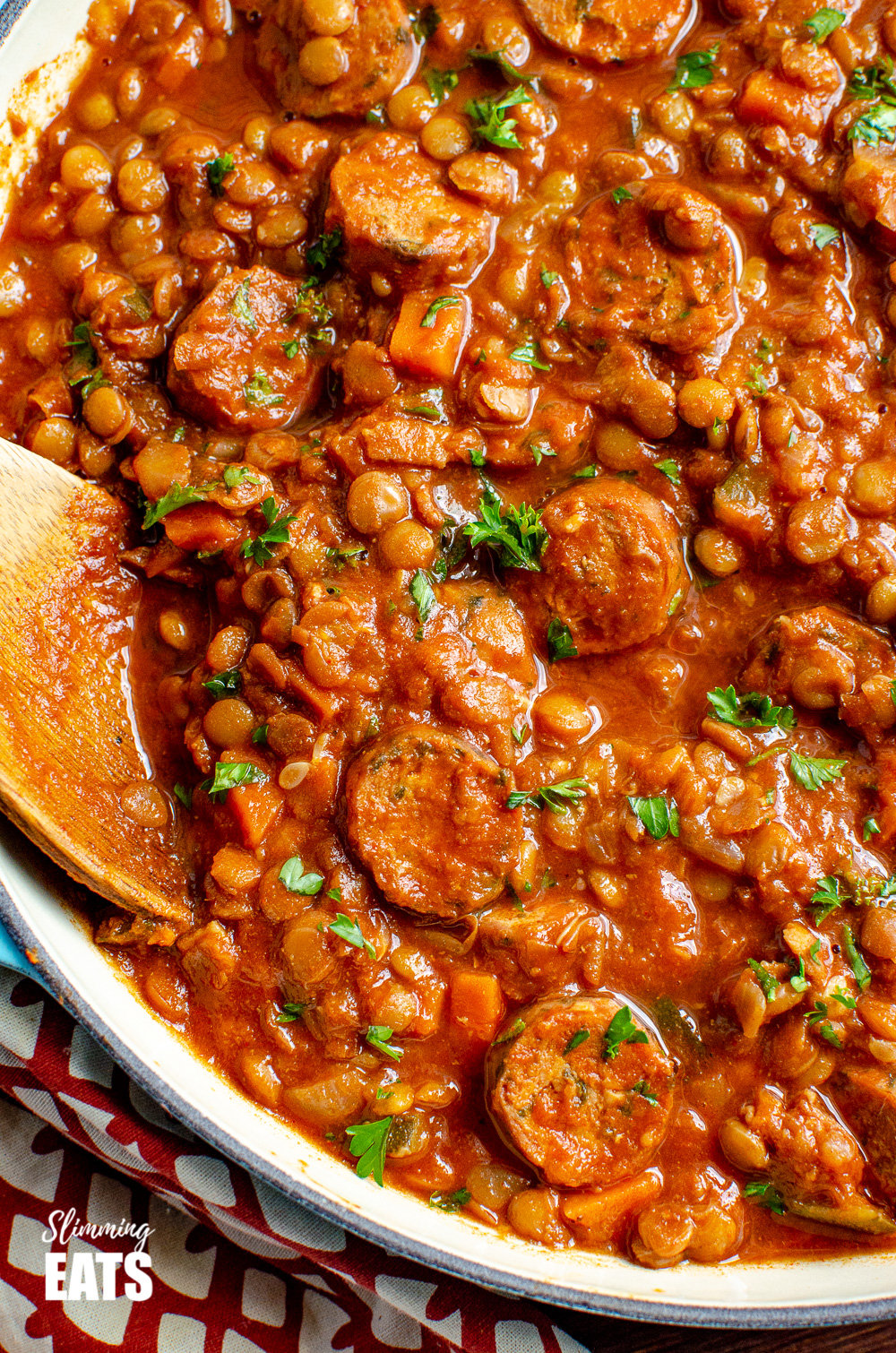 One Pot Sausage and Lentil Casserole - super easy recipe that the whole family will enjoy | gluten free, dairy free, Slimming Eats and Weight Watchers friendly close up of One Pot Sausage and Lentil Casserole in enamelled cast iron shallow dish