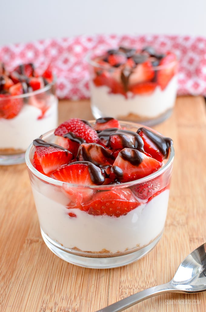 Strawberry Topped Greek Yoghurt Style Cheesecakes - Enjoy one of these delicious Strawberry Cheesecakes that are super quick to make and a delicious treat. Slimming Eats and Weight Watchers friendly strawberry Greek yoghurt cheesecake in glass dish