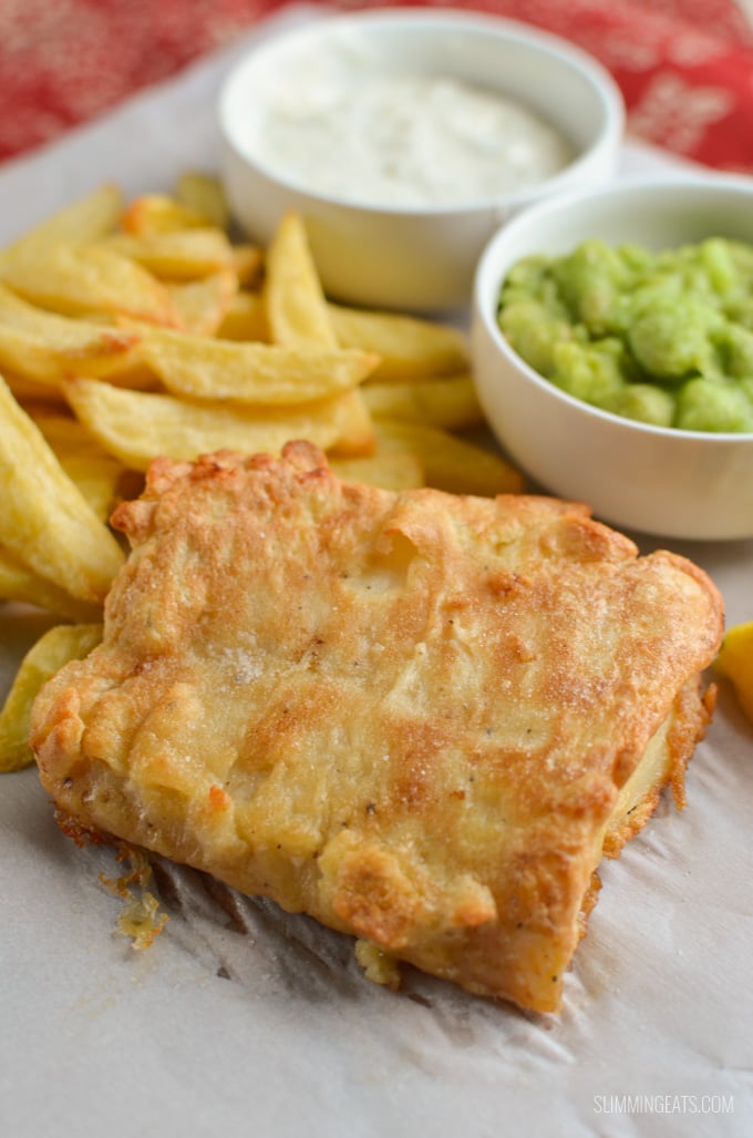Make this Best Ever Low Calorie Fish and Chips for the perfect chip shop fakeaway night close up of homemade Fish and Chips with mushy peas and tartar sauce