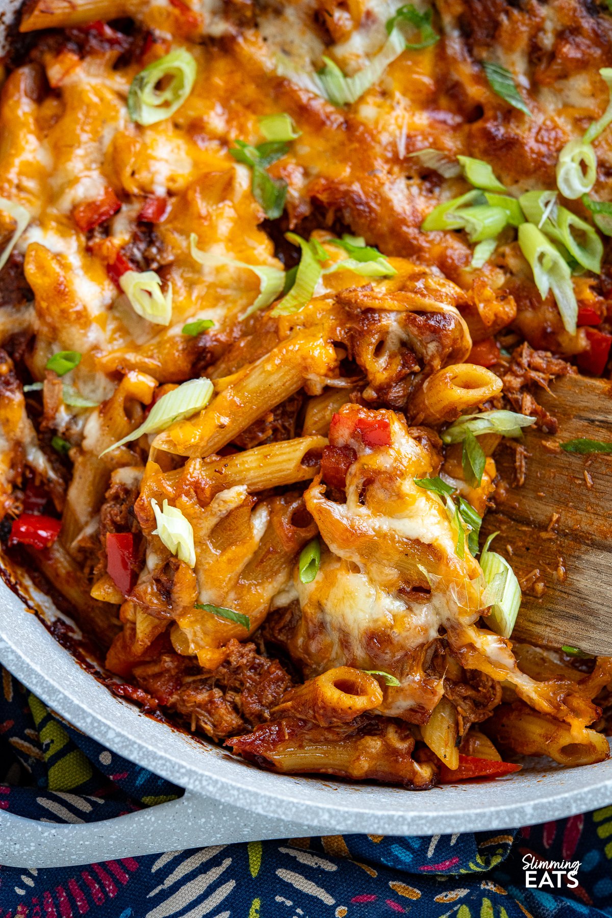 close up of Pulled Pork Pasta Bake in ceramic double handled light grey pan