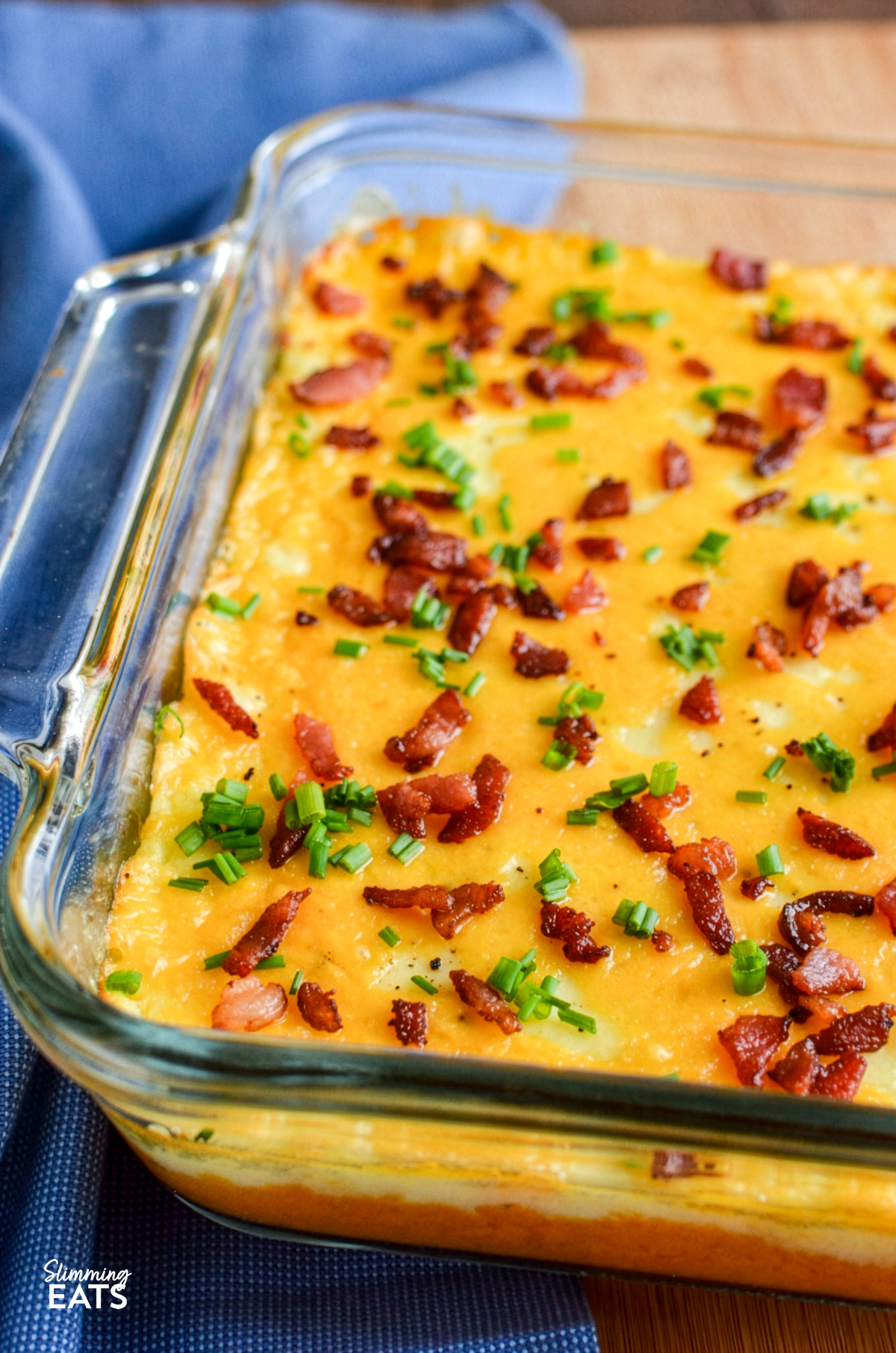 layered mashed potato casserole in a glass oven dish