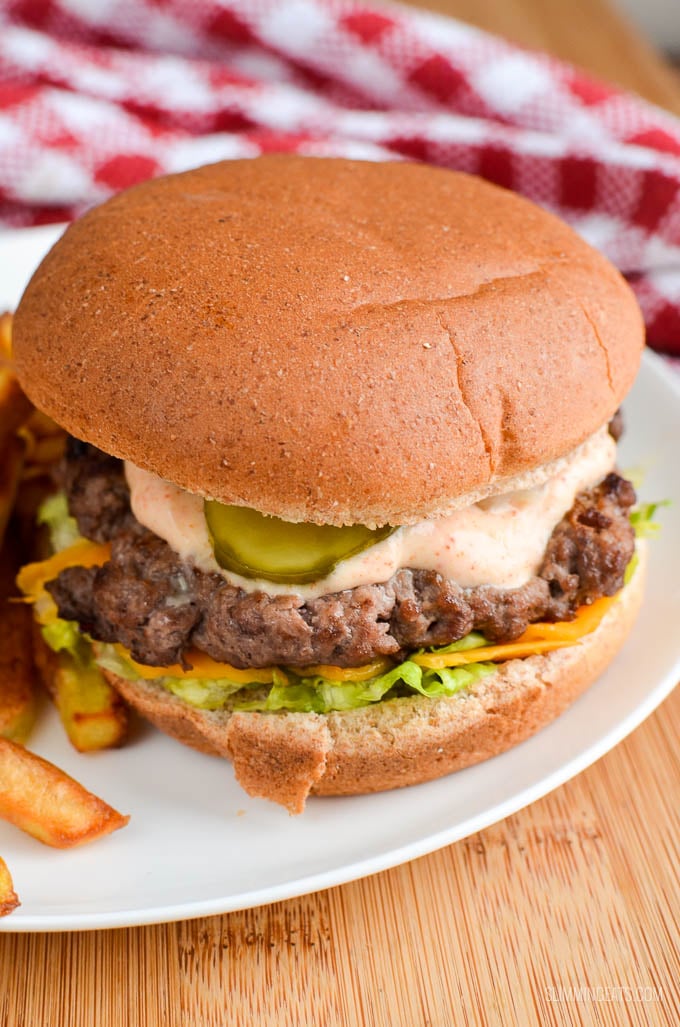 Big Mac and Fries Fakeaway - A healthier take on a everyone's favourite fast food burger meal. That can also be made using healthy extras and a few changes to the sauce. Slimming Eats and Weight Watchers friendly close up of lighter version of big mac and fries fakeaway on a white plate